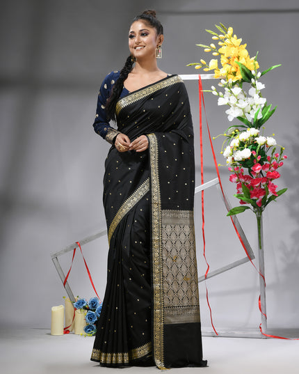 DESH BIDESH Black Kanjivaram silk blend saree with silver zari butti.
