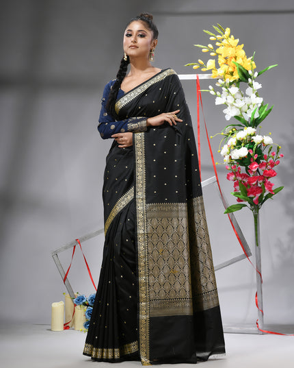 Elegant black Kanchipuram silk saree with intricate jacquard weave.