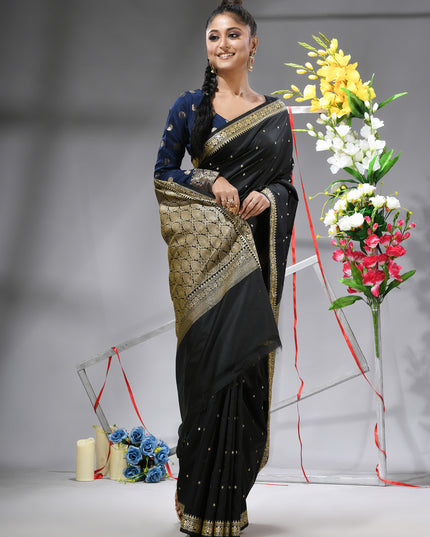 Model showcasing black Banarasi Kanjivaram wedding saree.