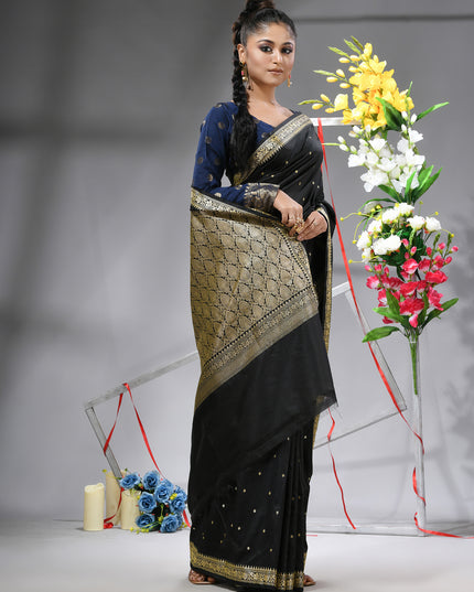 Black silk blend saree with traditional woven silver zari border.
