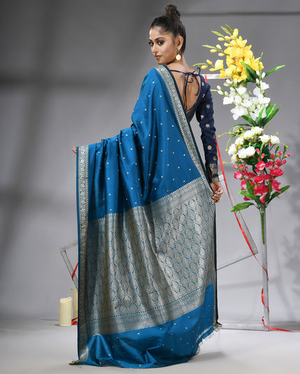 Blue silk blend saree with traditional woven silver zari border back view