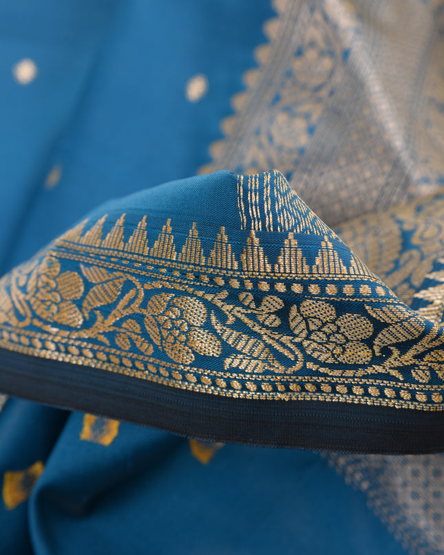 Soft silk blue saree with rich jacquard patterns for festive occasions.