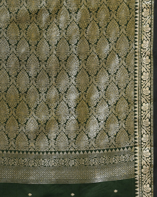 Bridal dark green silk saree with intricate silver zari butti work