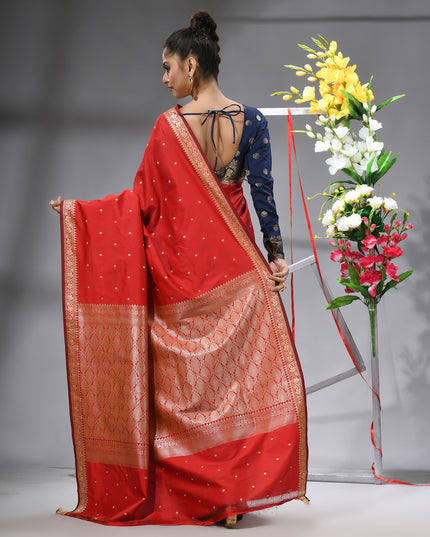Model showcasing red Banarasi Kanjivaram wedding saree back view