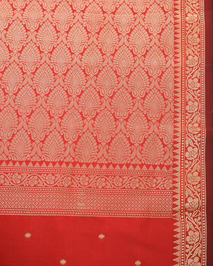 Bridal red silk saree with intricate silver zari butti work.