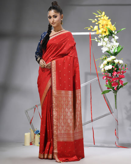 DESH BIDESH Red Kanjivaram silk blend saree with silver zari butti.

