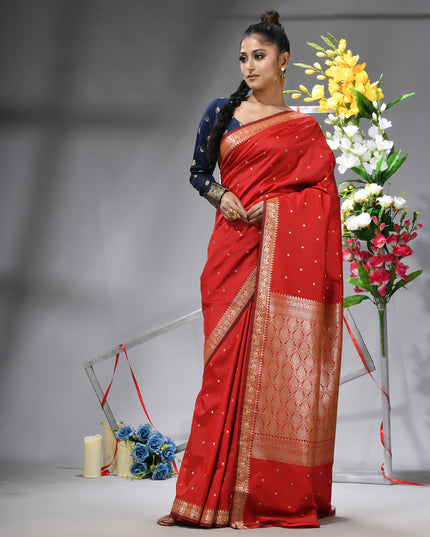 Model showcasing red Banarasi Kanjivaram wedding saree.