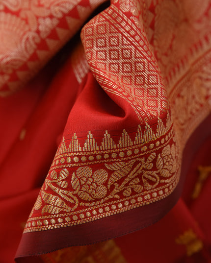 Close-up of the pallu design on DESH BIDESH red silk saree.