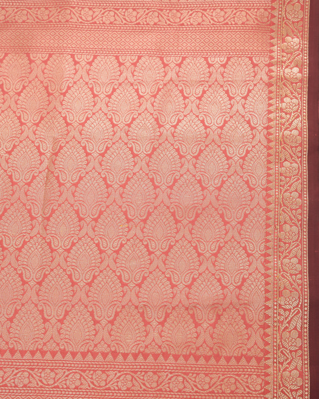 Soft silk salmon saree with rich jacquard patterns for festive occasions.