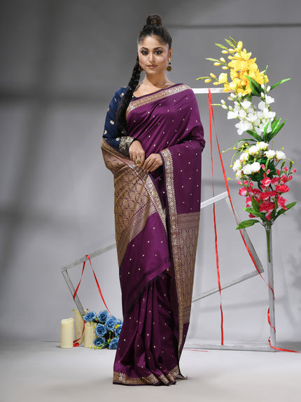 DESH BIDESH Magenta Purple Kanjivaram silk blend saree with silver zari butti.