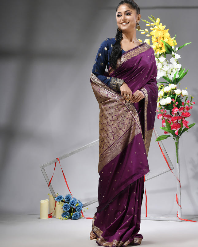 Magenta Purple silk blend saree with traditional woven silver zari border.