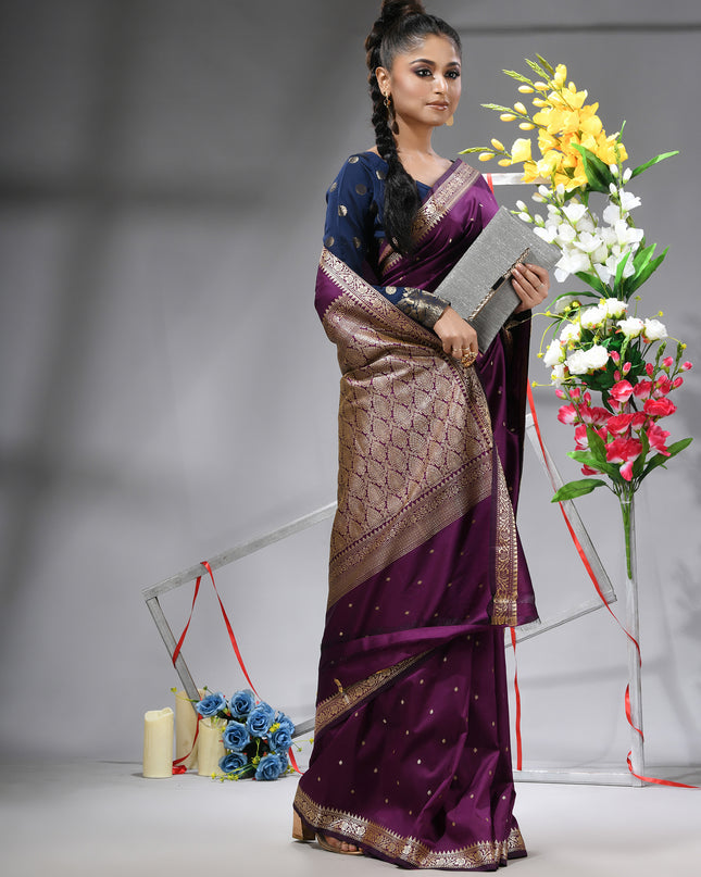 Luxurious Magenta Purple Kanjivaram saree with matching blouse piece.