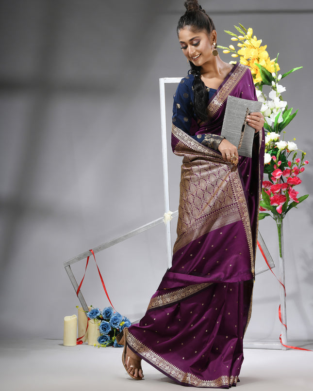 Luxurious Magenta Purple Kanjivaram saree with matching blouse piece.