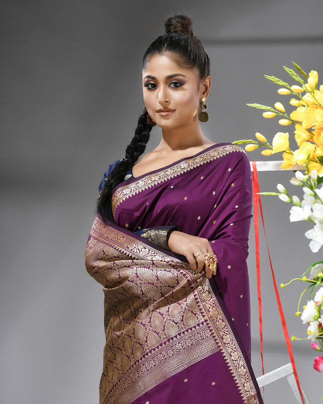 Close-up of silver zari butti on Magenta Purple pure silk saree.