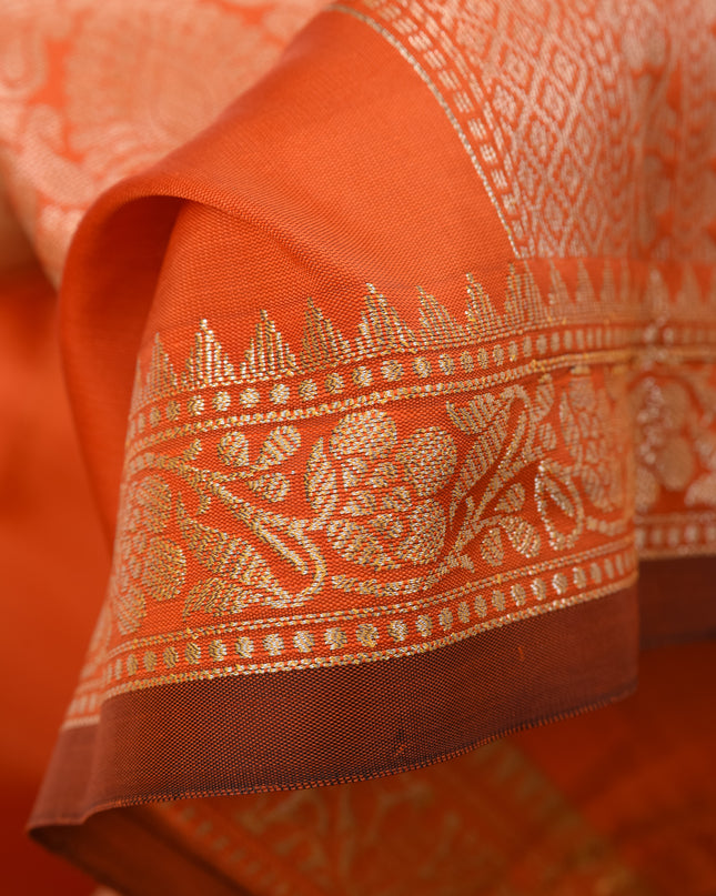 Complete orange wedding wear saree look.