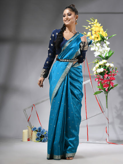 DESH BIDESH Sea Blue Kanjivaram silk blend saree with silver zari butti.