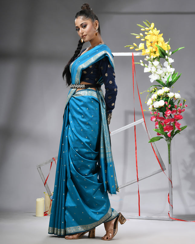 Sea blue silk blend saree with traditional woven silver zari border.
