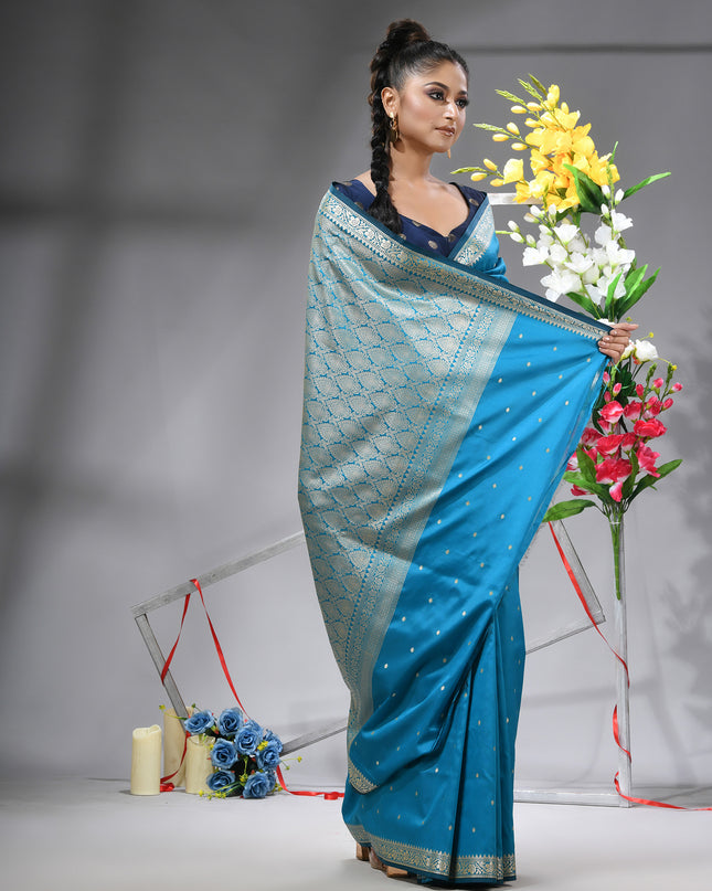Luxurious sea blue Kanjivaram saree with matching blouse piece.