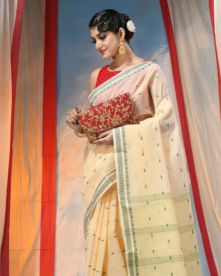 Exquisite Off-White & Green Pure Cotton Saree with Ethnic Woven Motifs